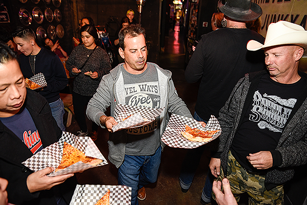 Evel Pie General Manager Joey D Amore serves up slices to guests