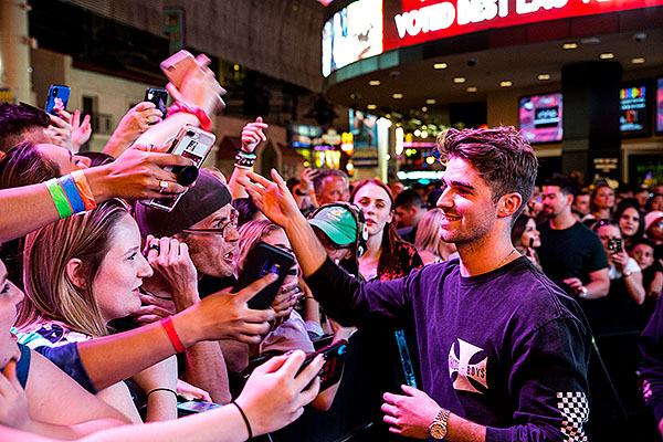 Fans celebrate with Drew Taggart of The Chainsmokers during Viva Vision light show debut at Fremont Street Experience 5.31.19