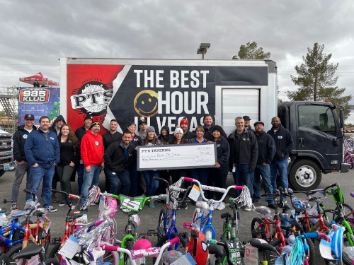 PTs Team Members Pose with 30000 Check and Donated Bikes