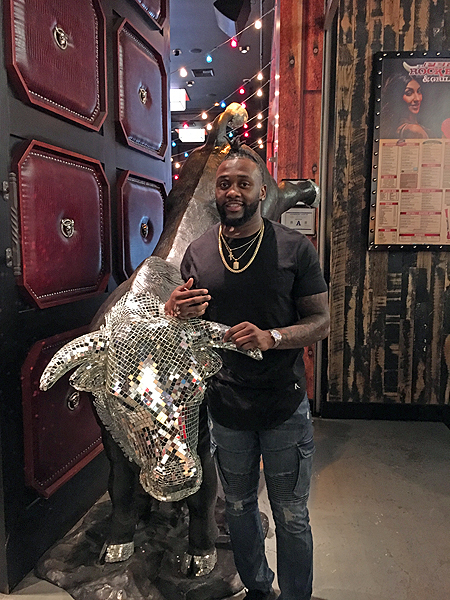 Dallas Free Safety Kavon Frazier Poses with Glitter Bull at PBR Rock Bar Grill Sunday Feb. 5 2017
