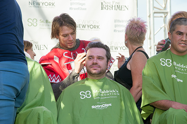 Cast member of TOURNAMENT OF KINGS shaves a head during 8th annual St. Baldricks Day event at New York New York Hotel Casino
