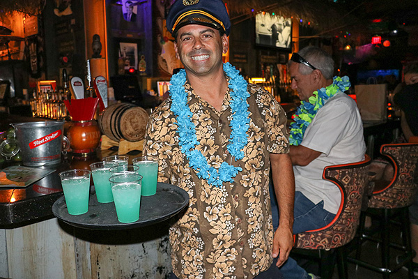Golden Tiki General Manager Joey DAmore serves tiki punch to guests. 