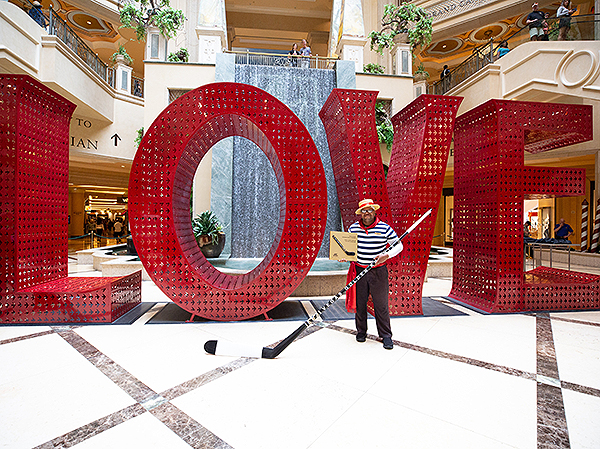 Carnell Johnson stands in front of the LOVE installation at The Venetian and The Palazzo