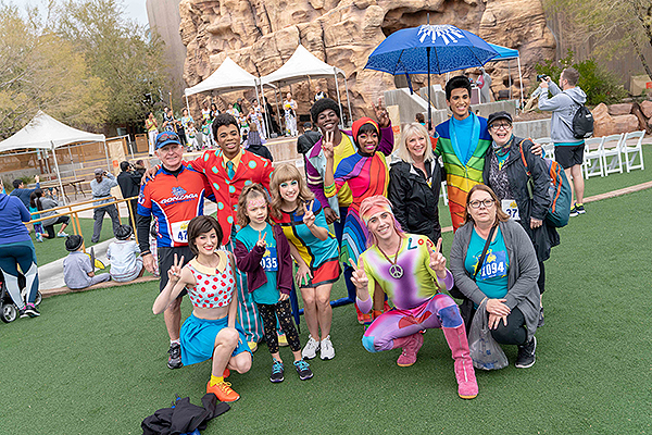 Cirque du Soleil performers pose with Run Away with Cirque du Soleil participants March 2
