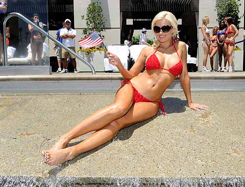 Holly_Madison_at_WET_REPUBLIC_-_waterfall_with_American_flag