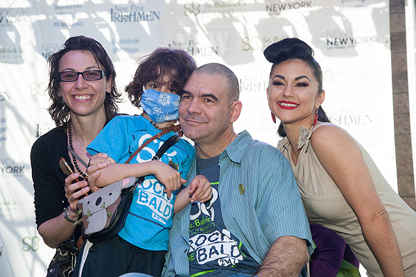 Leslie Saula and Elan Saula pose with family friend John Katsiolmetes as he gets shaved by ABSINTHE star Melody Sweets